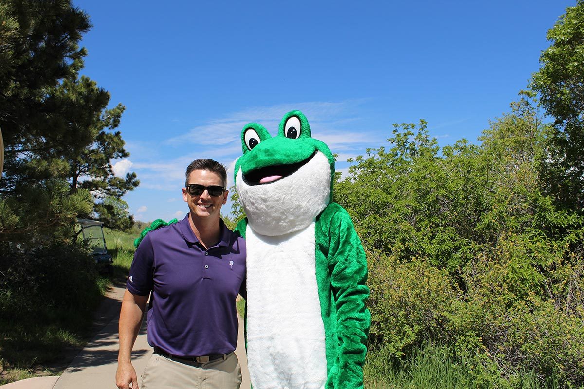 Golfer with Mascot