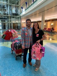 A photo of the Zimmermans at the hospital with bags to deliver