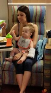 Baby Owen sitting on his moms lap