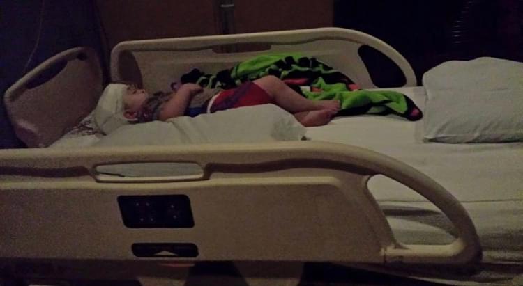 Owen in a hospital bed