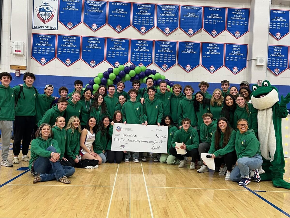 Cherry Creek kids group photo with large check and the Bags of Fun mascot.