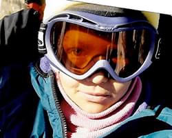 Close up of Gabby with her snow goggles on.